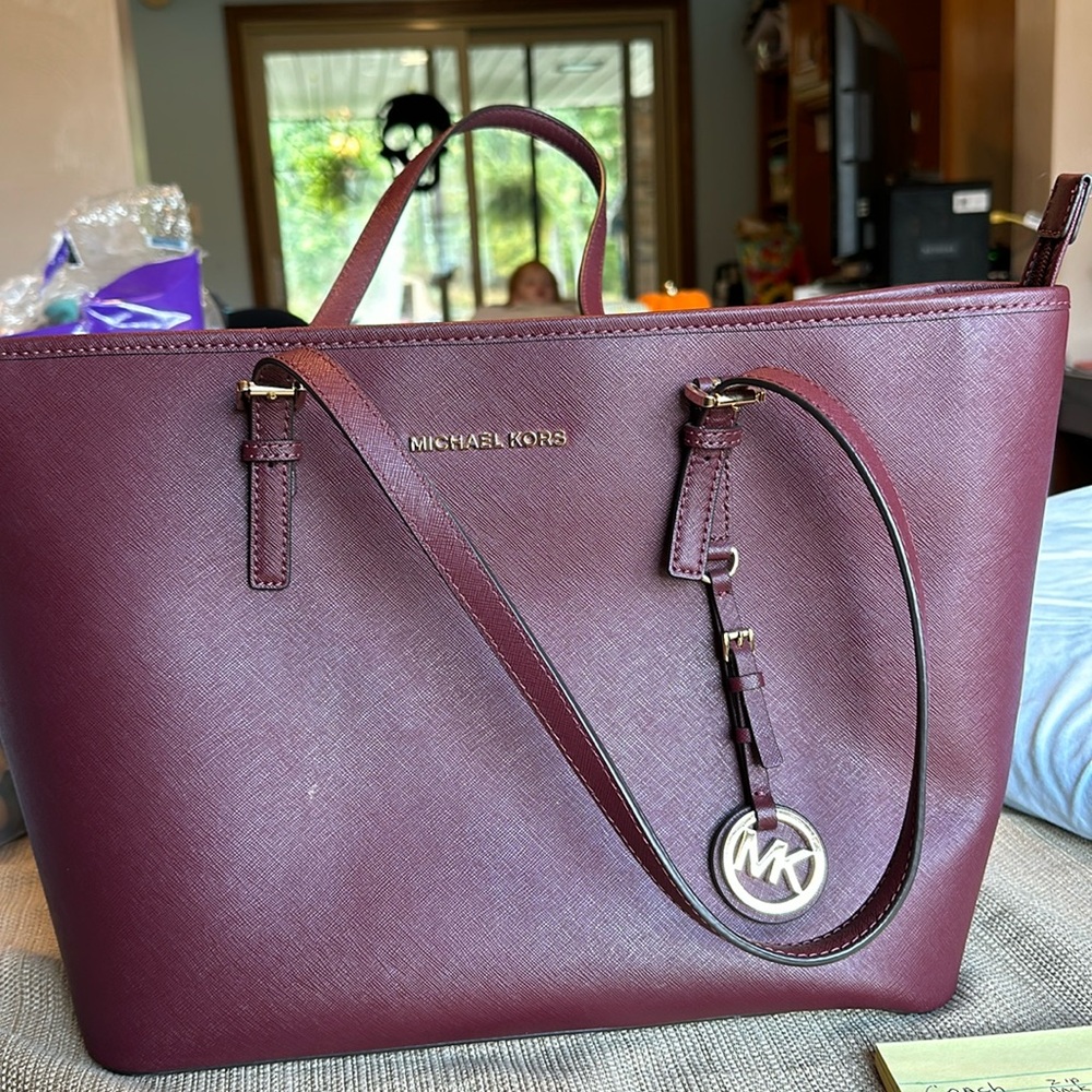 Michael kors purse-maroon small stain interior bottom